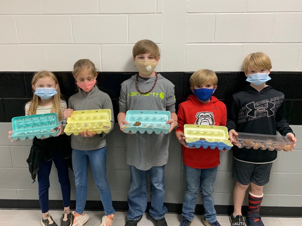 students with rocks